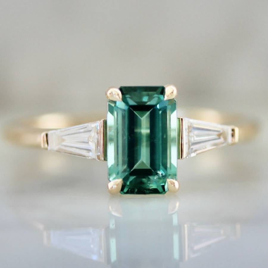 Green Emerald Cut Toure ring with tapered baguette diamond sides