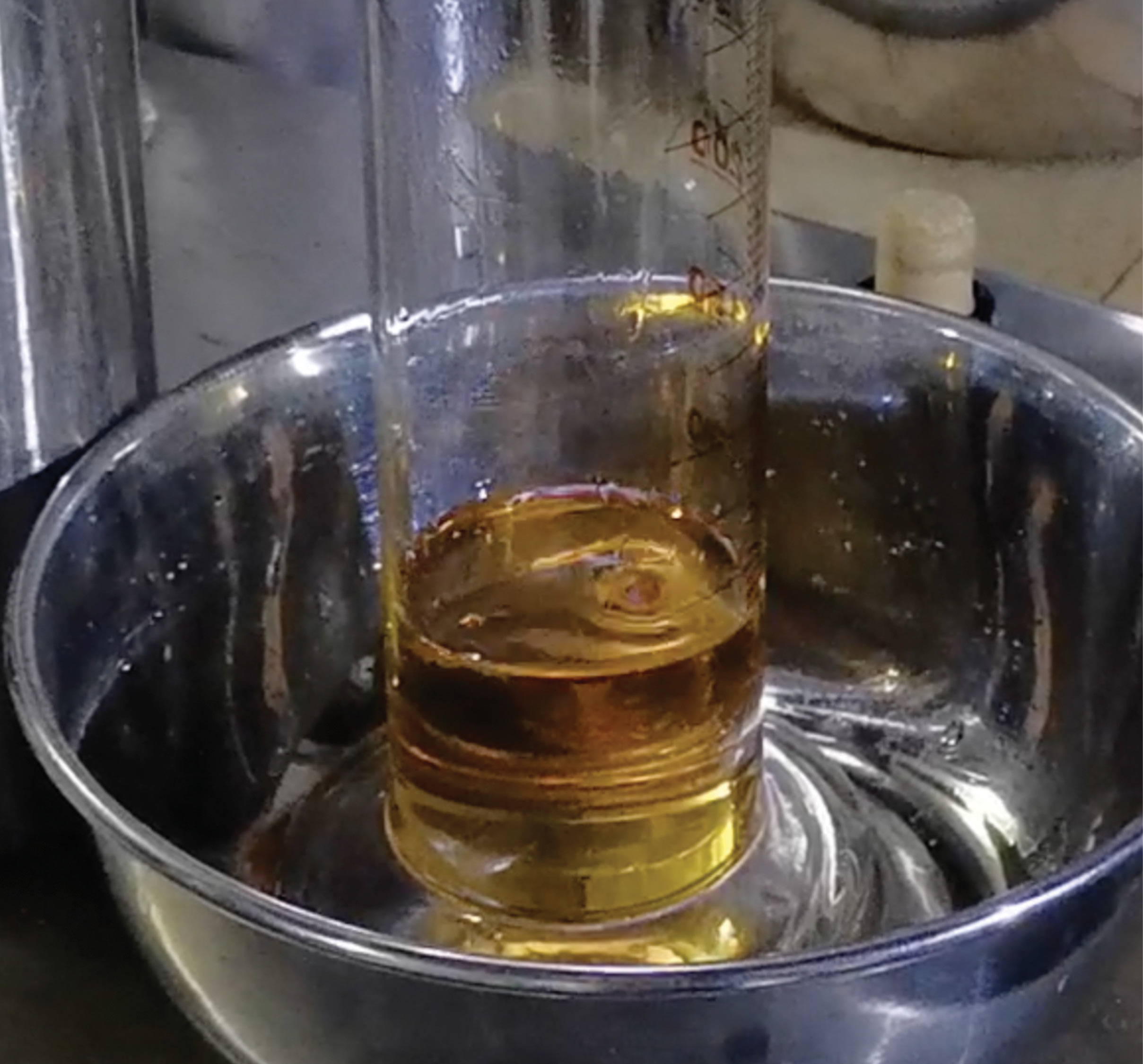 distilled cypress oil in cylinder