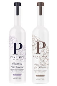 Two bottles of Penelope spirits with different flavors.