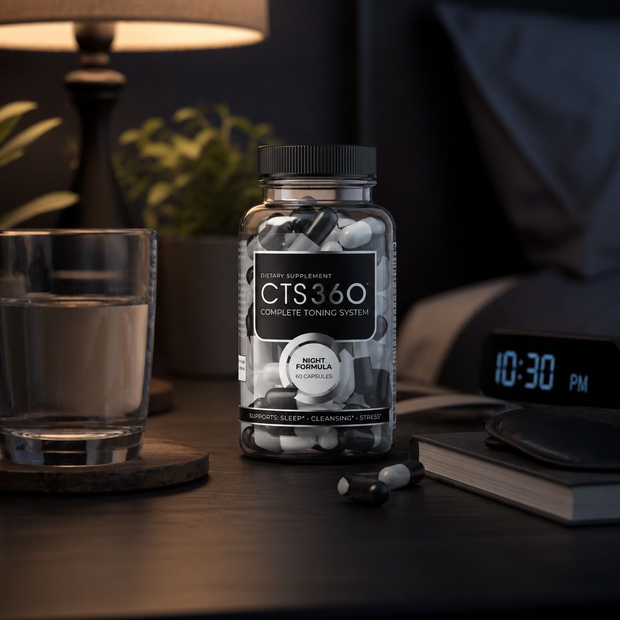 A bottle of sleep pills beside a glass of water and an alarm clock.