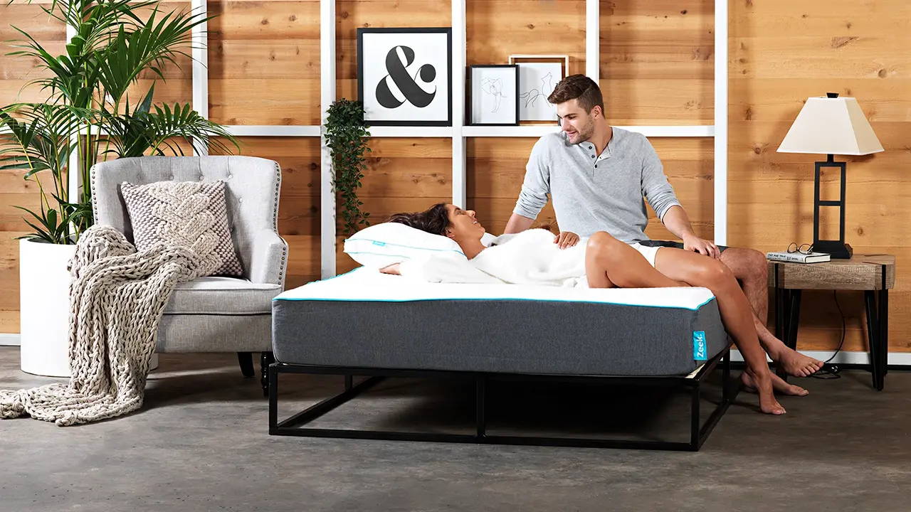 Two people looking lovingly at each other, on a Hybrid Mattress from Zeek.com.au