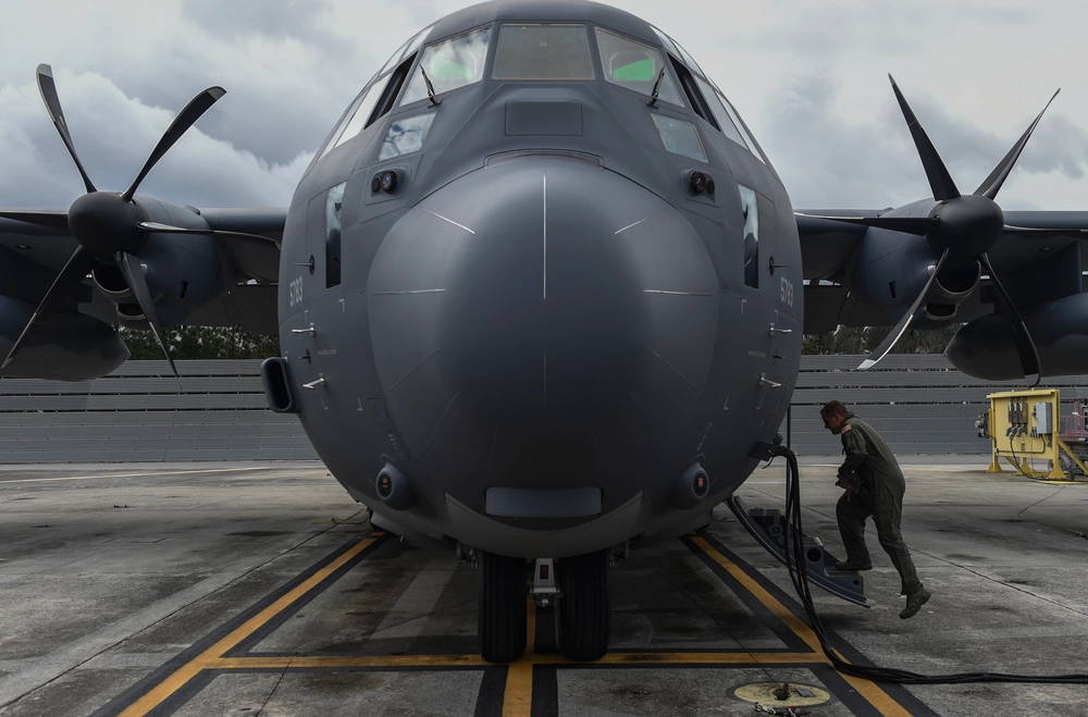 Col. Sean Farrell, commander of the 1st Special Operations Wing, boards an MC-130J Commando II at Lockheed Martin in Marietta, Ga., Dec. 11, 2015. The MC-130J will undergo modifications to become an AC-130J Ghostrider, which will provide the 1 SOW with close air support and air interdiction capabilities. (U.S. Air Force photo by Senior Airman Ryan Conroy)