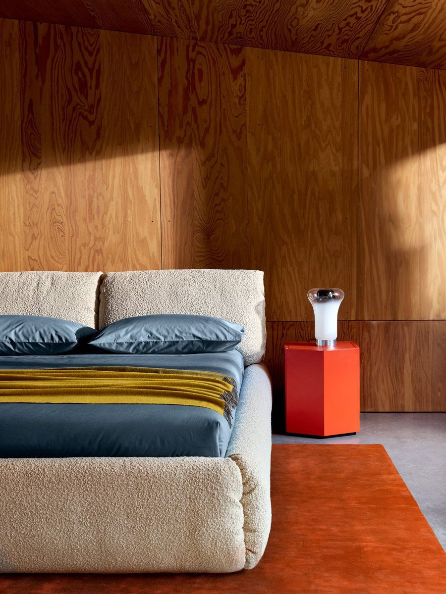 Cozy Zanotta bedroom with a plush Za:za bed and colourful accent table.