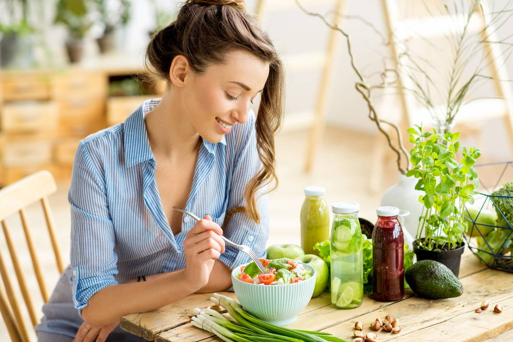 healthy-woman-eating-vegan-food
