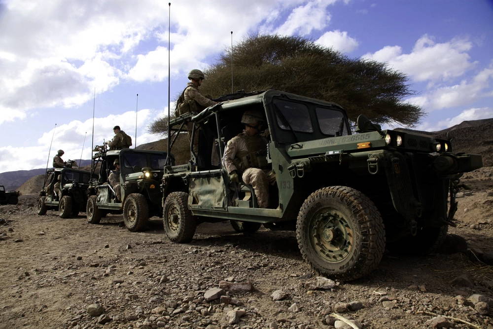 Marines with Weapons Platoon, Kilo Company, Battalion Landing Team 3/5, 15th Marine Expeditionary Unit, prepare for convoy operations with the company’s light strike vehicles, Feb. 11. The platoon practiced working with the unit’s light strike vehicles, or LSVs, during the unit’s sustainment training in Djibouti, designed to increase unit cohesion, practice the fundamentals of their trades and take advantage of a unique opportunity to train in a foreign country. The 15th MEU is deployed as part of the Peleliu Amphibious Ready Group as a U.S. Central Command theater reserve force, providing support for maritime security operations and theater security cooperation efforts in the U.S. 5th Fleet area of responsibility. (U.S. Marine Corps photo by Cpl. John Robbart III/Released)