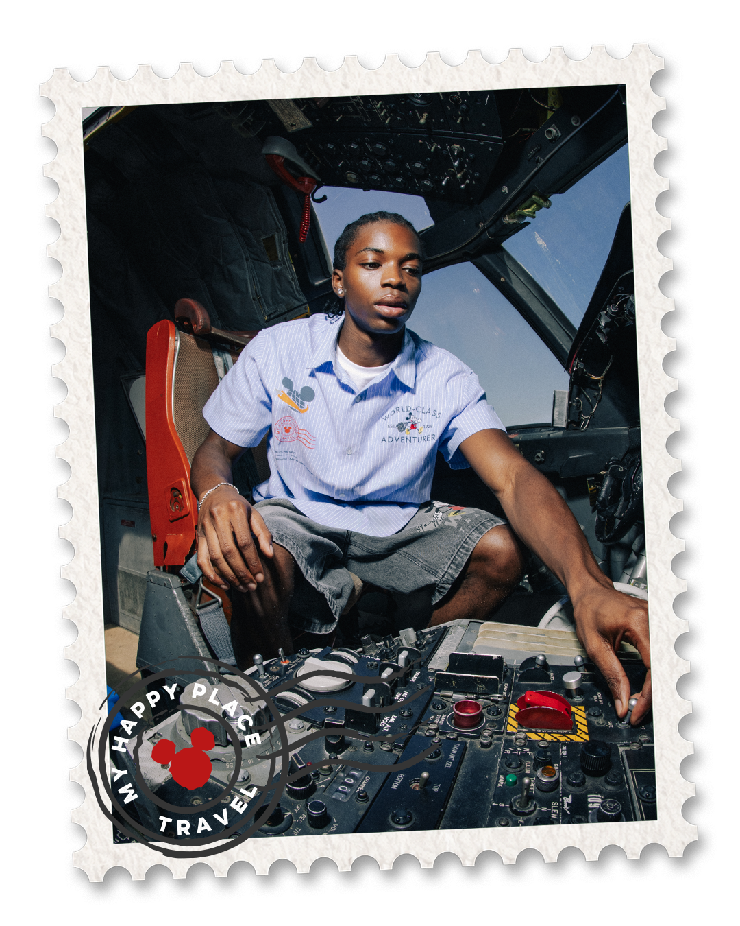 Person operating controls in an aircraft cockpit, wearing a blue shirt.