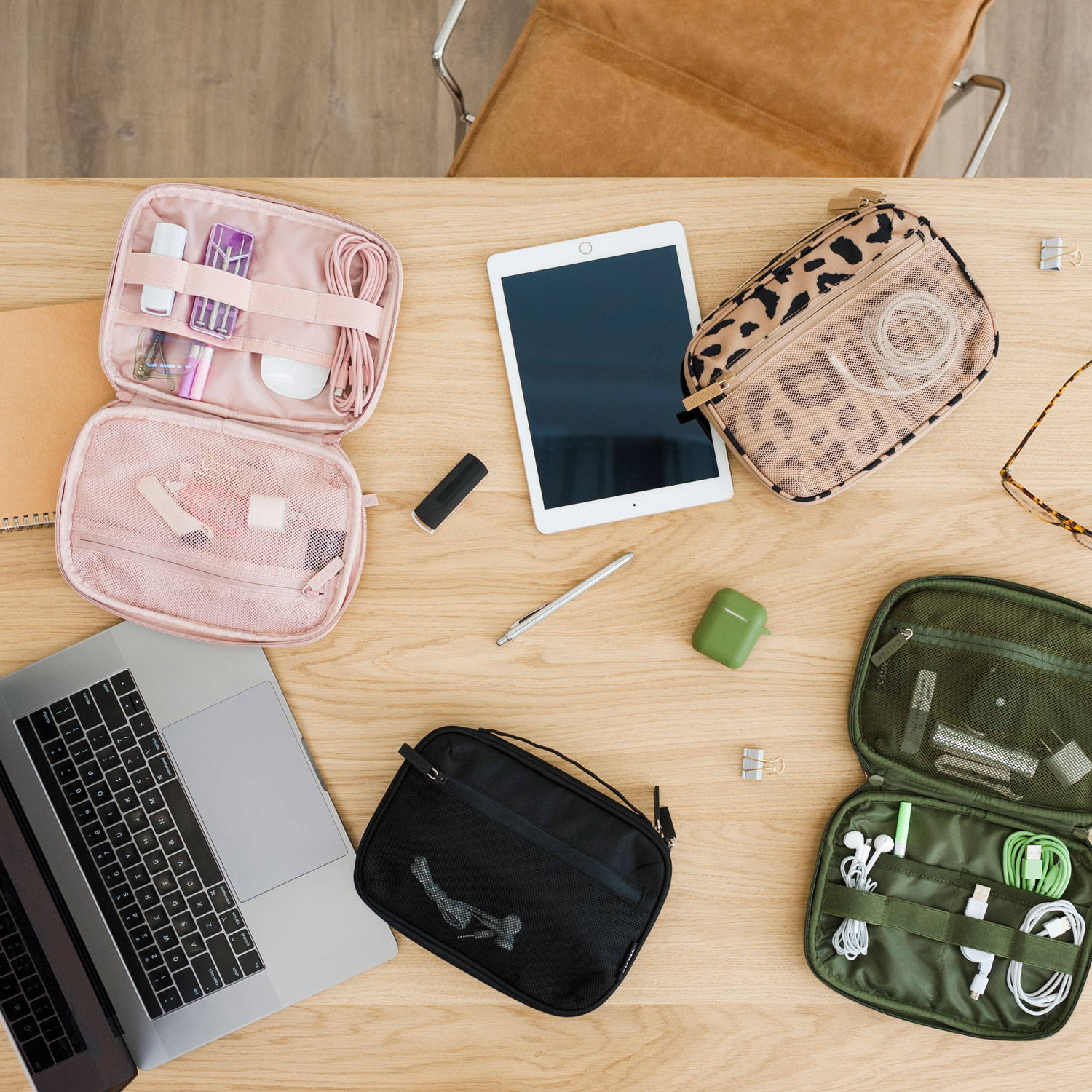 CALPAK Tech Organizers in all colors on a desk with other tech items.