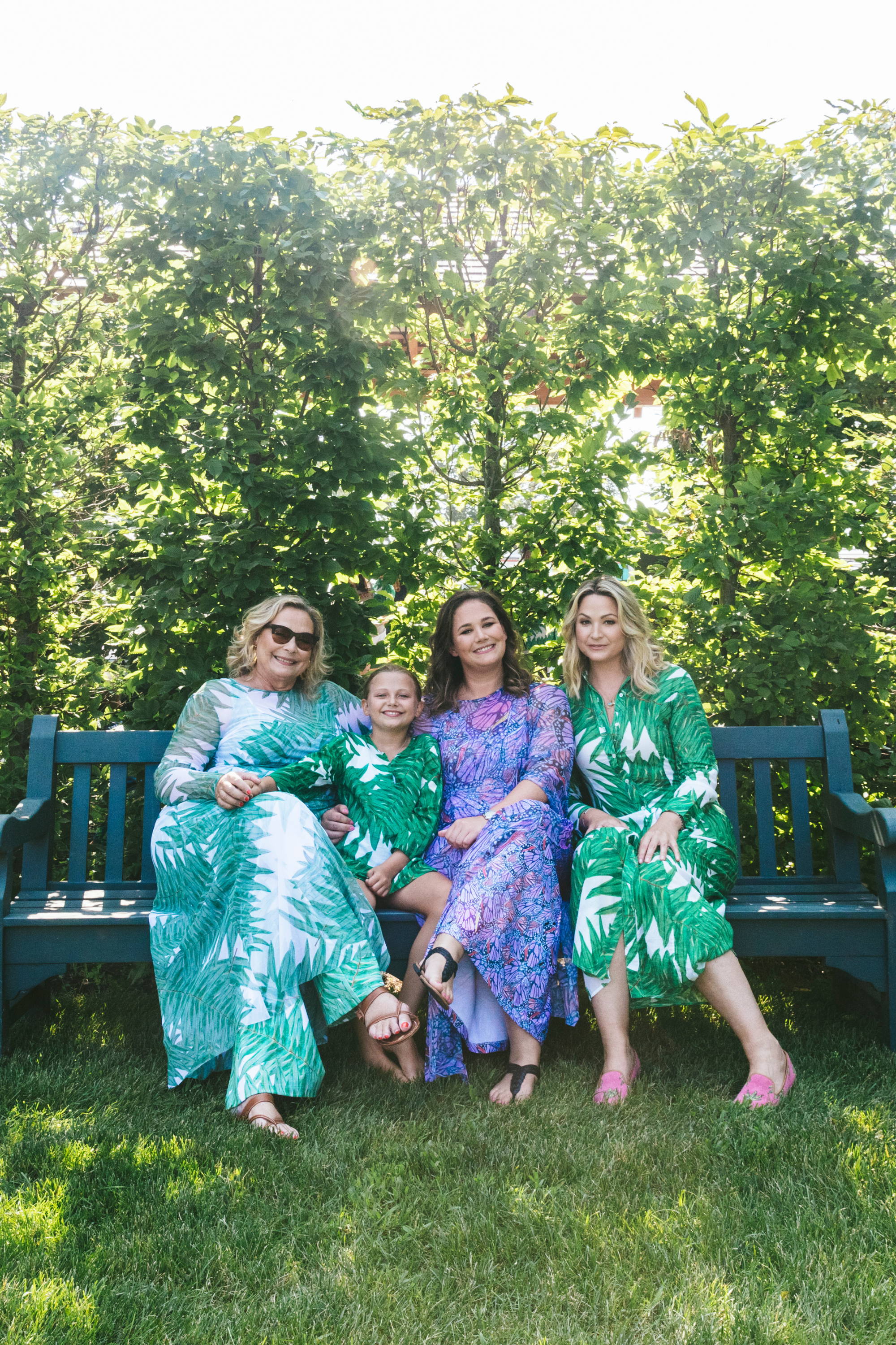 Ala Isham and her daughters wearing mesh kaftans over matching printed stretch knit dresses in Newport, Rhode Island