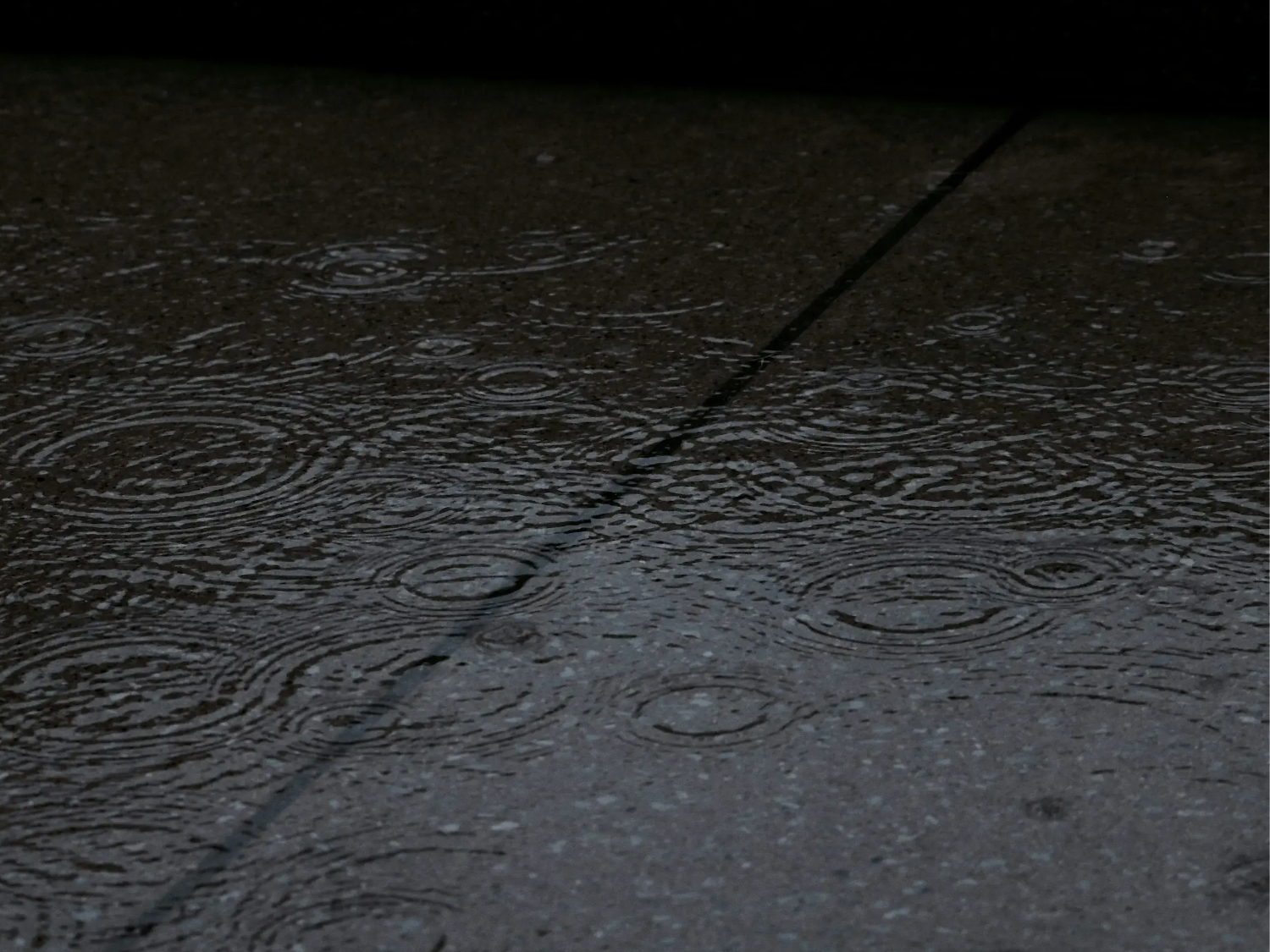 Rain falling on the pavement