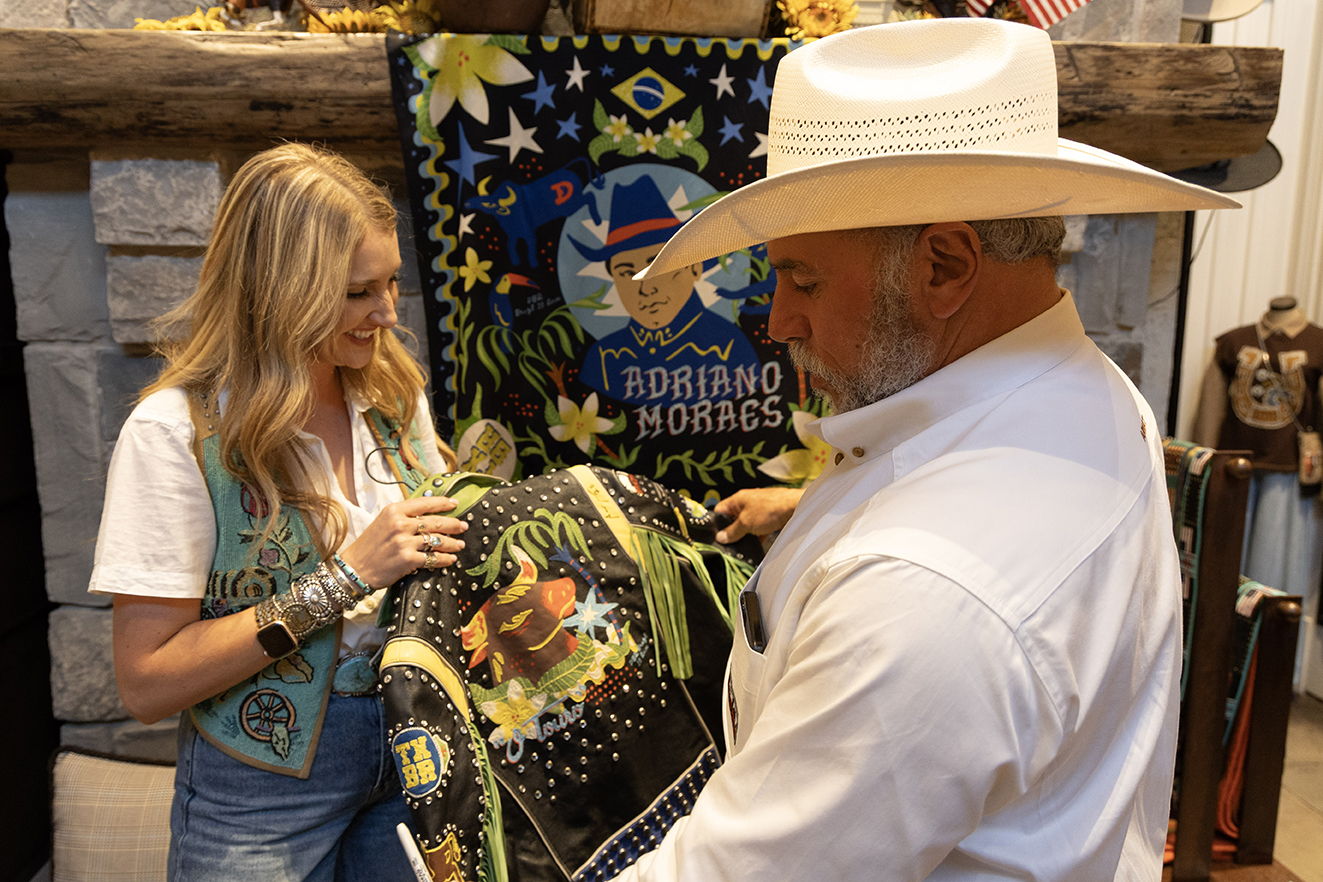 Adriano Moraes signing a jacket for our very own Savannah Welborn