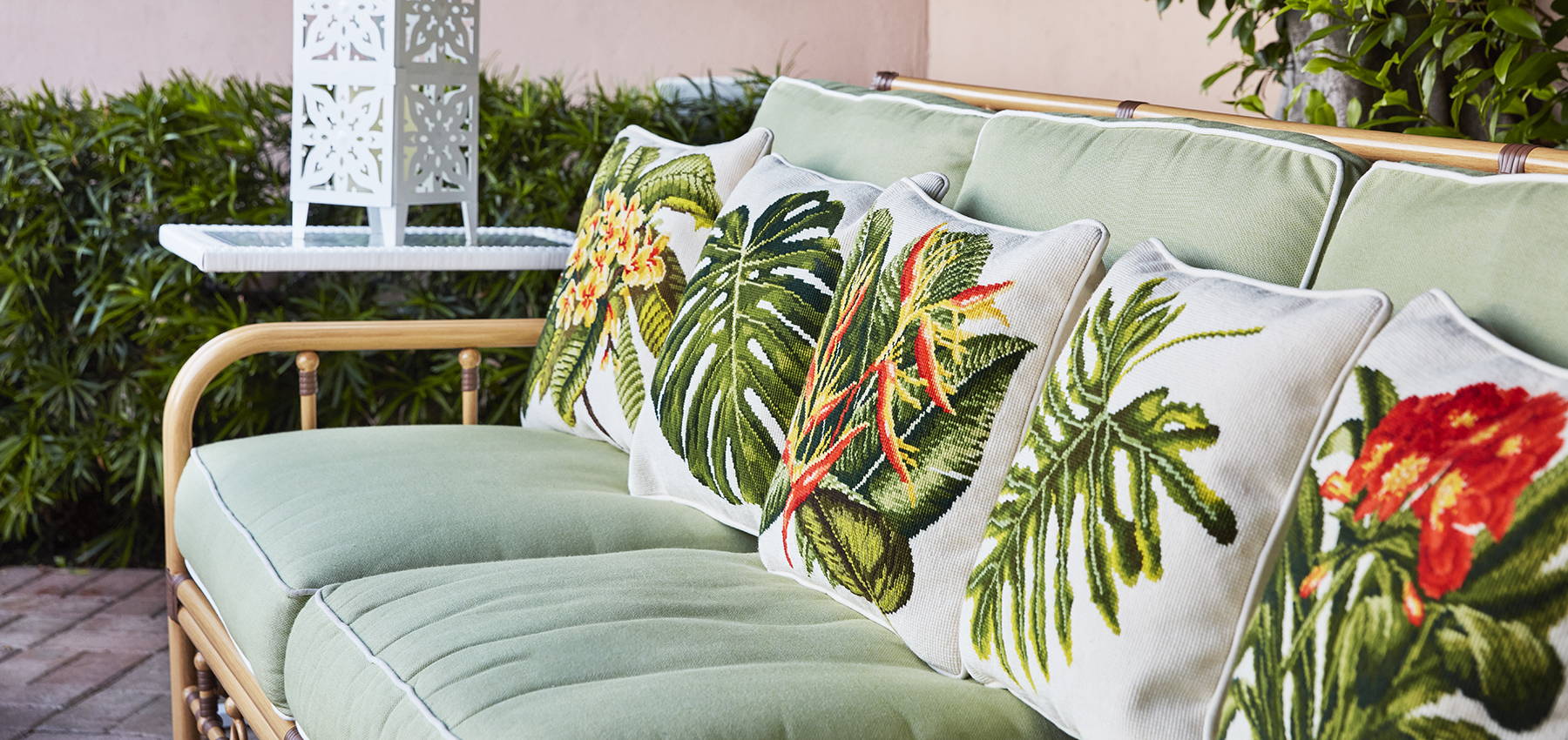 The Tropicals Collection finished pillows on outdoor sofa