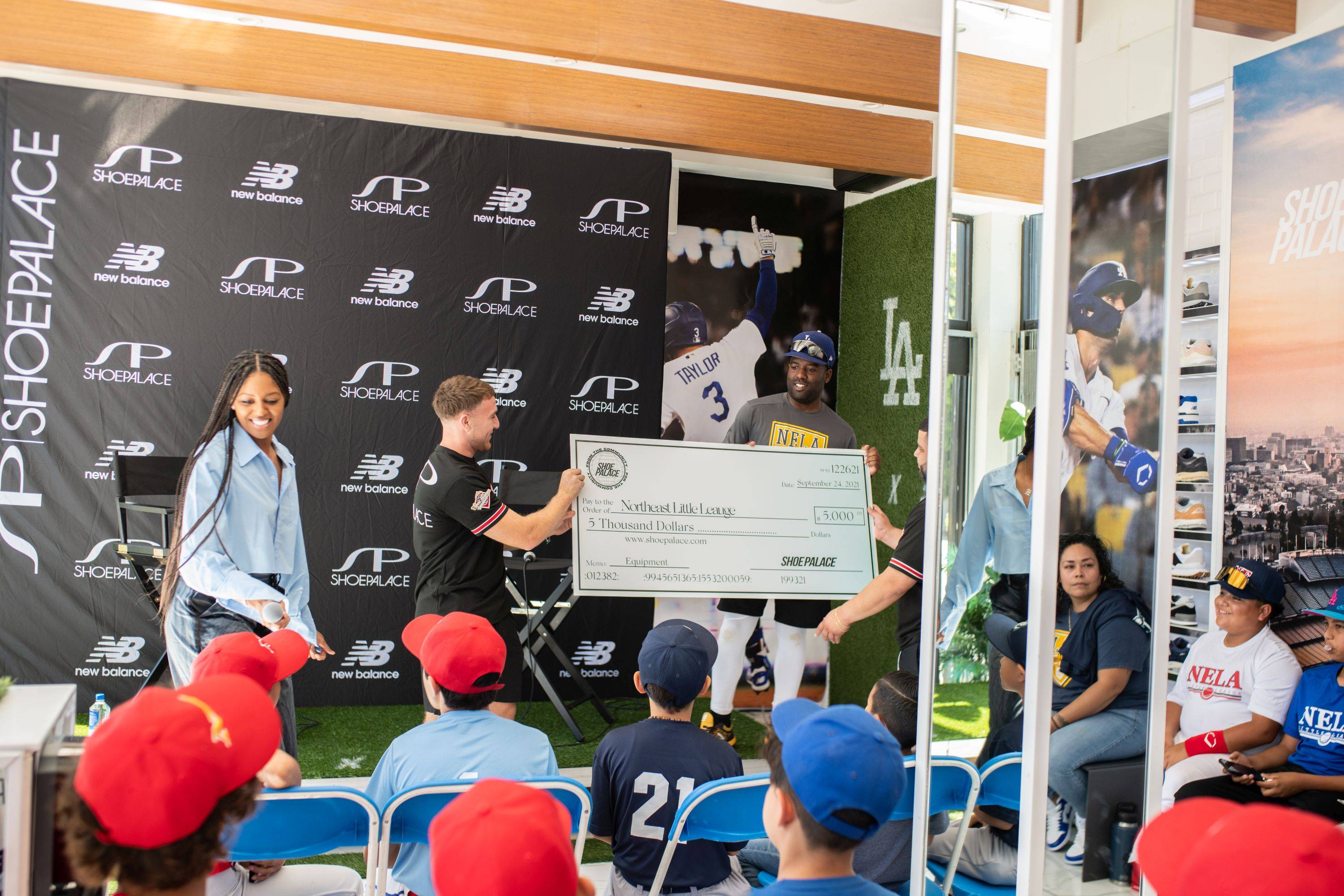 sp employee handing a check off