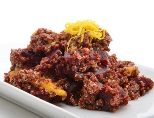 A plate of meatloaf garnished with orange zest.