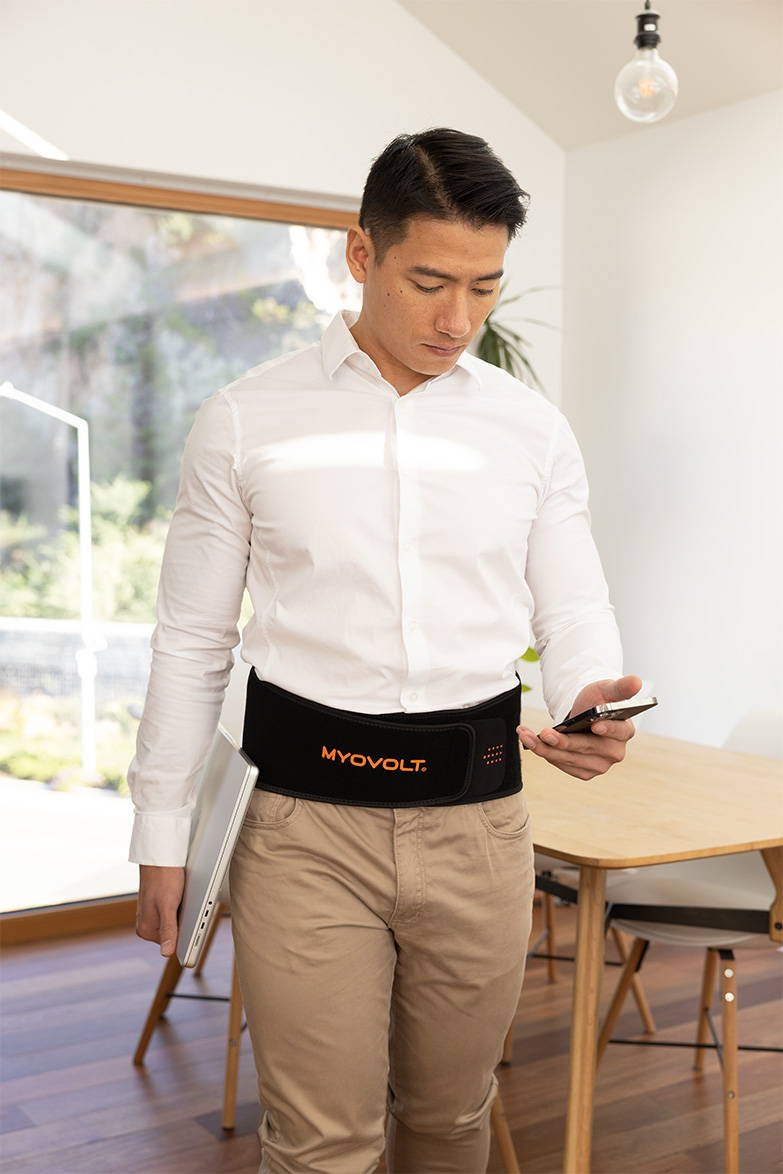 Myovolt vibration therapy back brace relieves muscle pain, tension and stiffness at work and home.