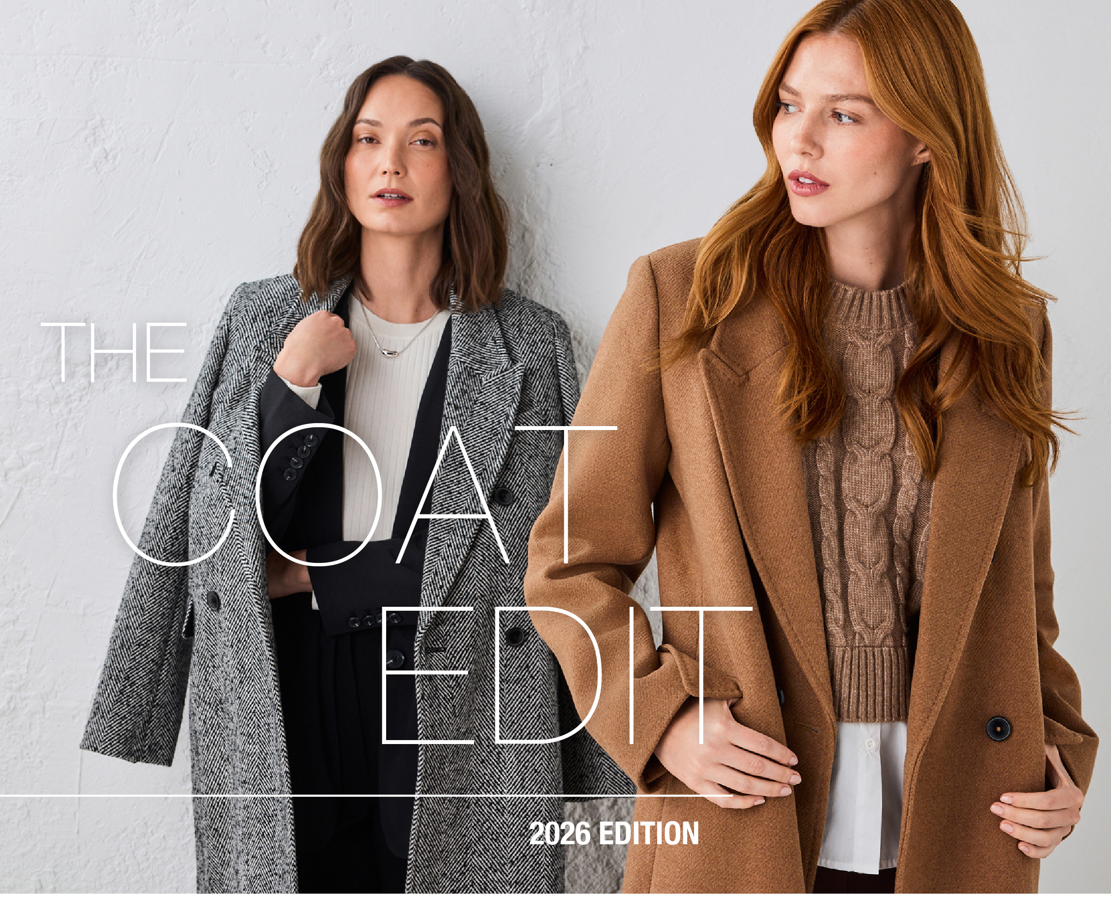 Two women modeling stylish coats for 