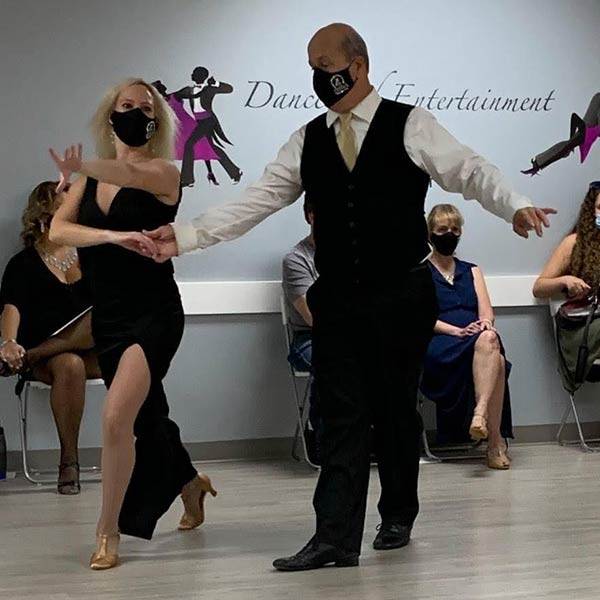 Ballroom dancers wearing face masks