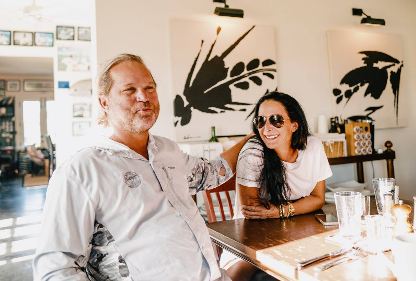 Clint and his wife sitting at the table