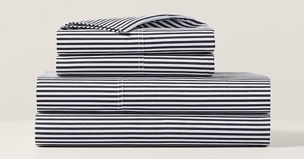black and white striped bedsheets folded and stacked