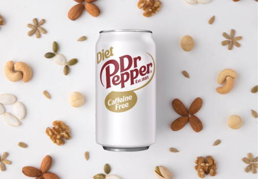 12 oz Can of Diet Dr. Pepper surrounded by a variety of nuts 