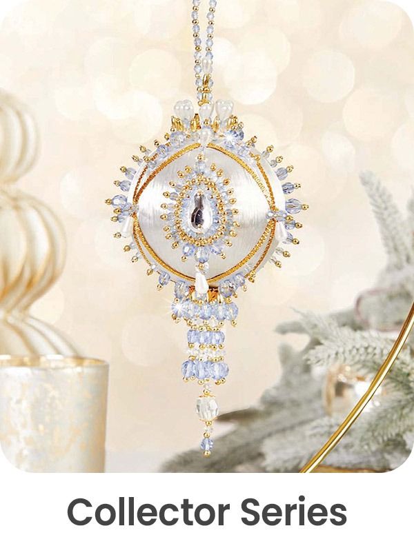 Gold and crystal pendant from the Collector Series, with decorative elements.