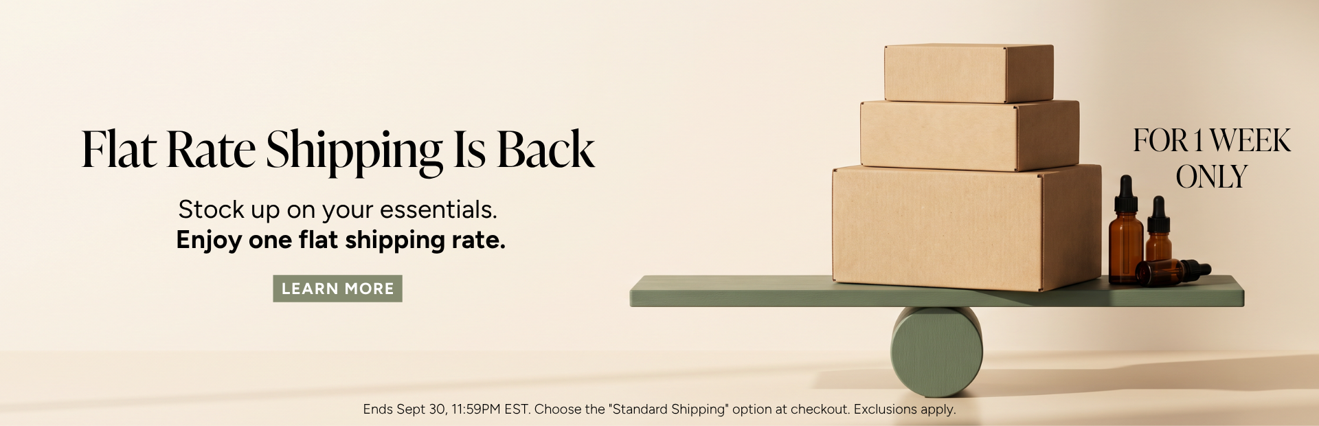 Flat rate shipping promotion with stacked boxes and products on a table.