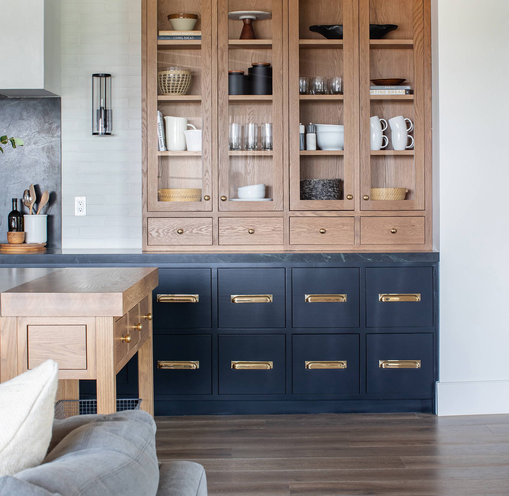 Navy and oak kitchen design by Dagan Designs with wooden floor and neutral furnishings and decor