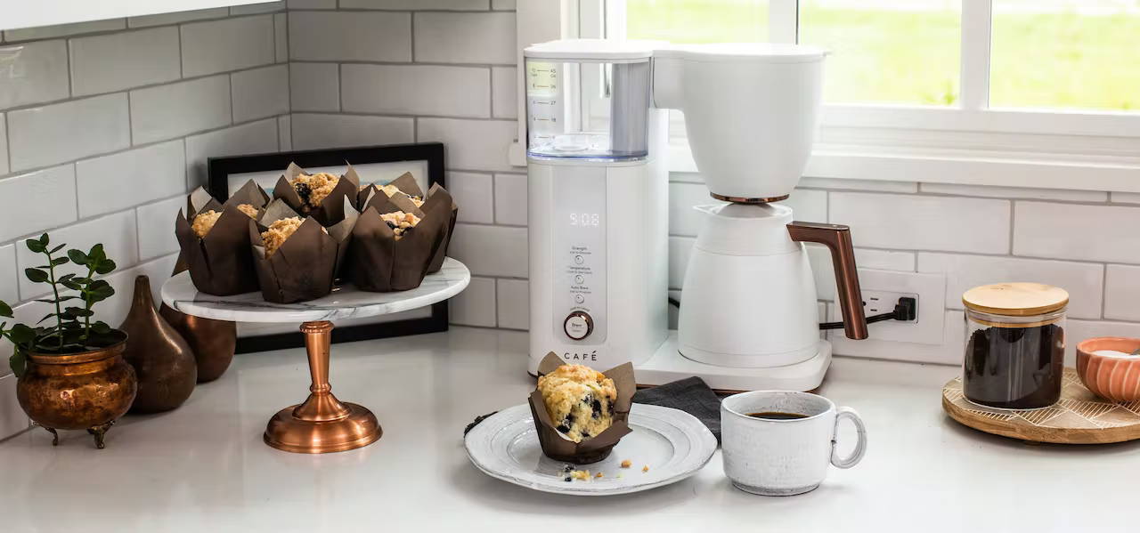 Cafe matte white coffee maker with muffin