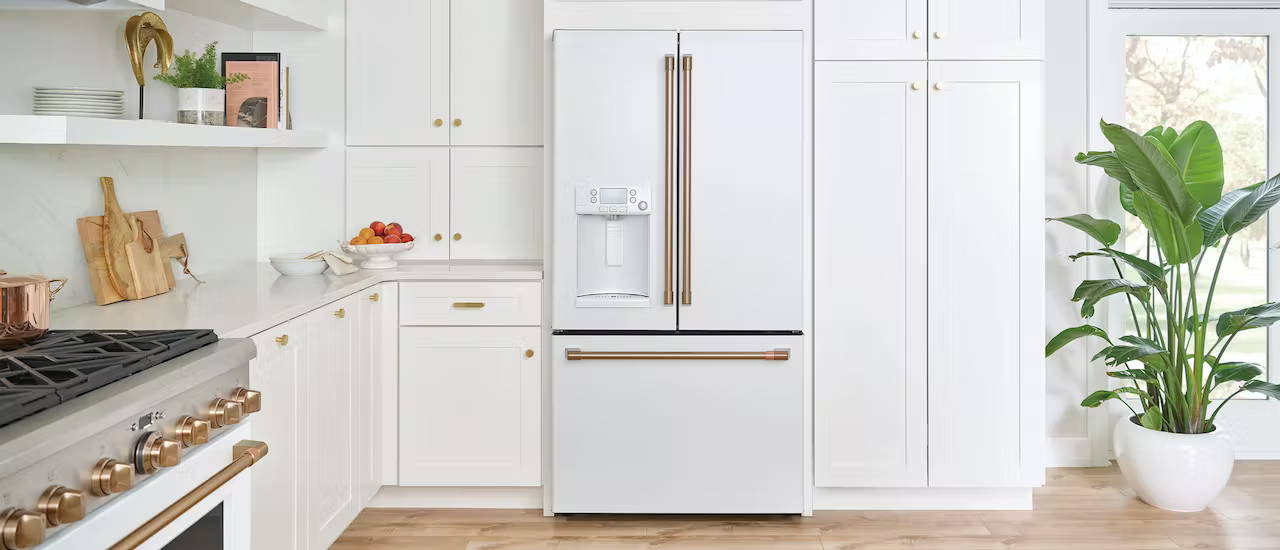 matte white cafe refrigerator in white cabinets