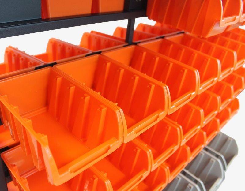 orange bins placed at upper section of the bin rack