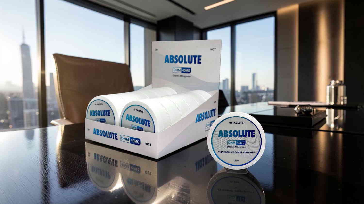 Display of Absolut products on a table with a city view.