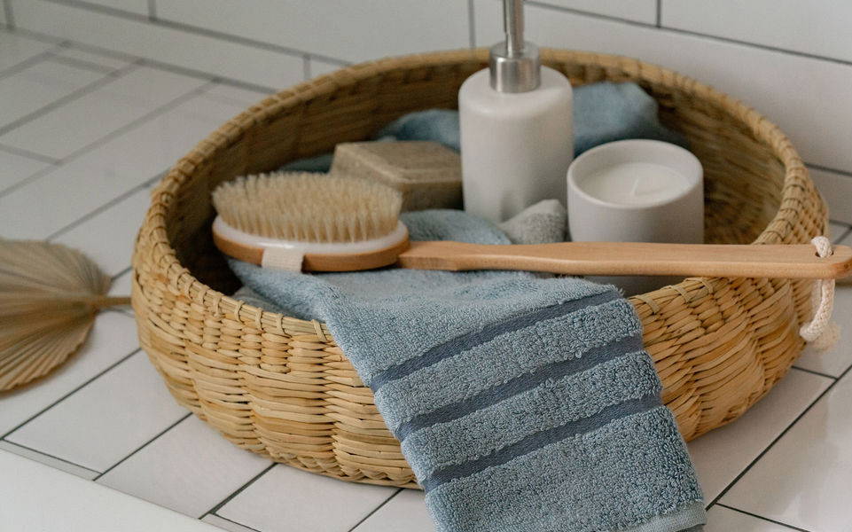 Rolled bamboo bath towels on shelf