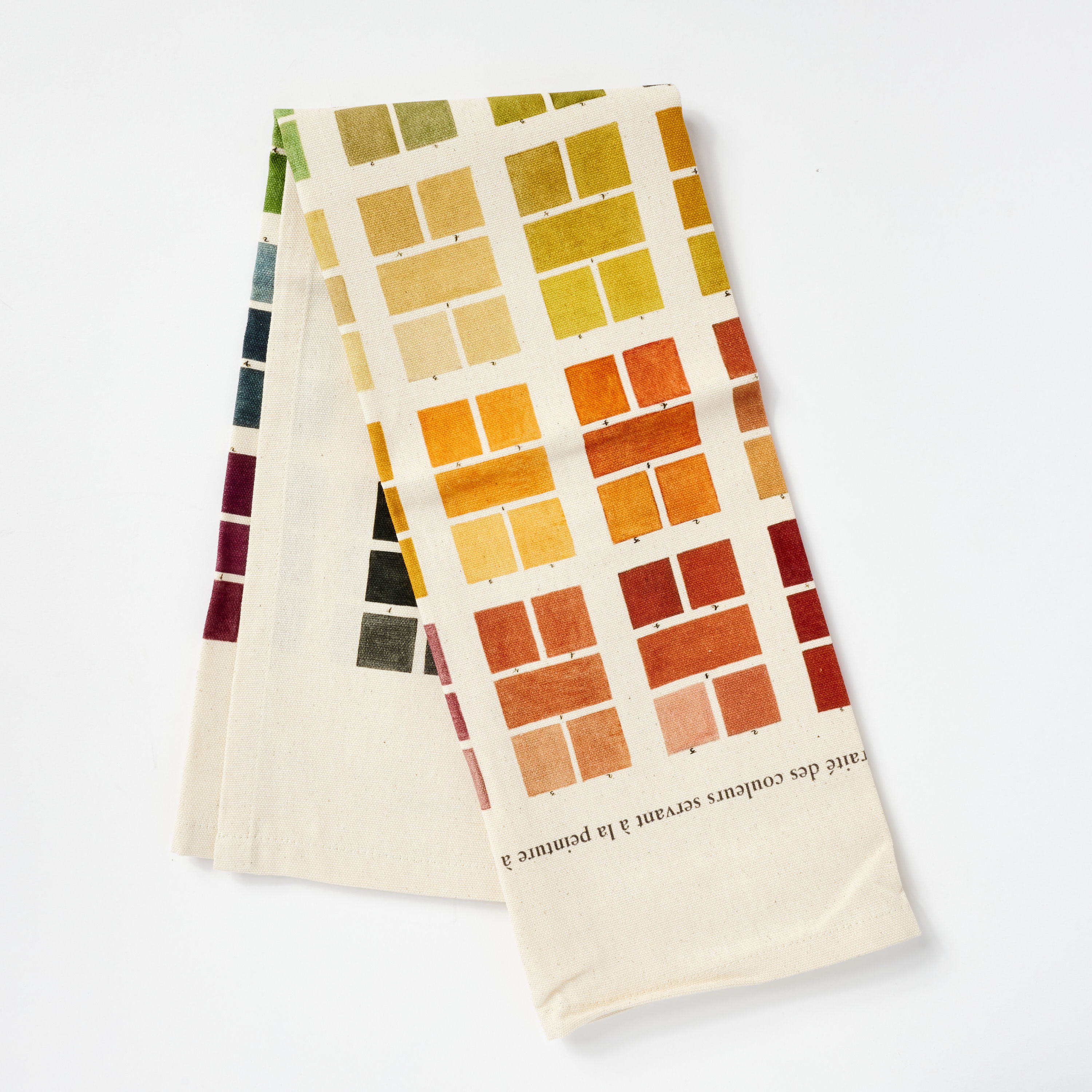 Colorful fabric showcasing various paint swatches arranged in a grid pattern.