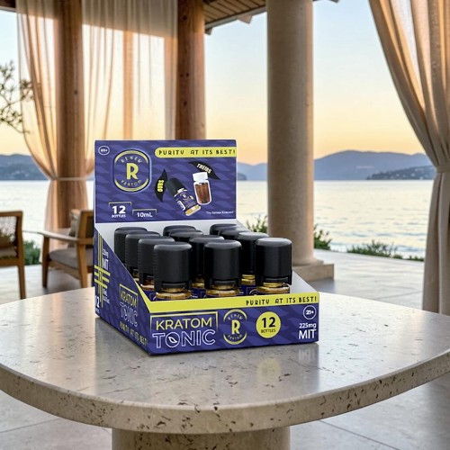 Display of Kratom products on a table by a scenic waterfront.