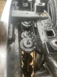 Top-down view of three black circular horn assemblies mounted vertically behind front grille
