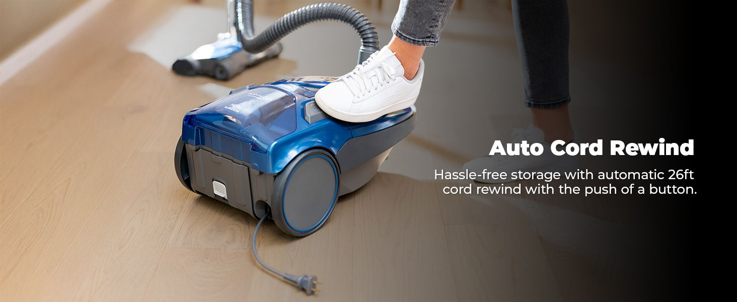 Vacuum cleaner with automatic cord rewind feature activated by foot.