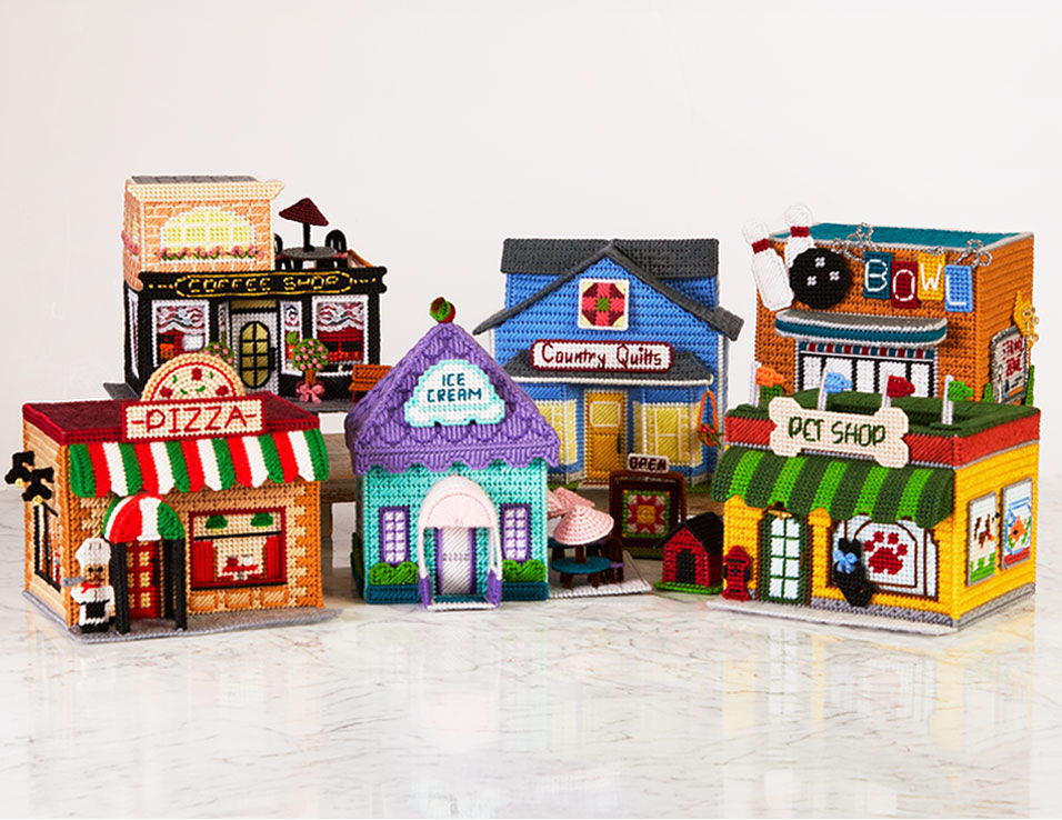 Colorful toy buildings resembling various shops and restaurants.