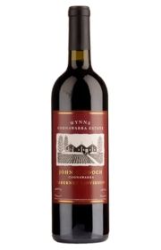 A bottle of red wine with a labeled design.