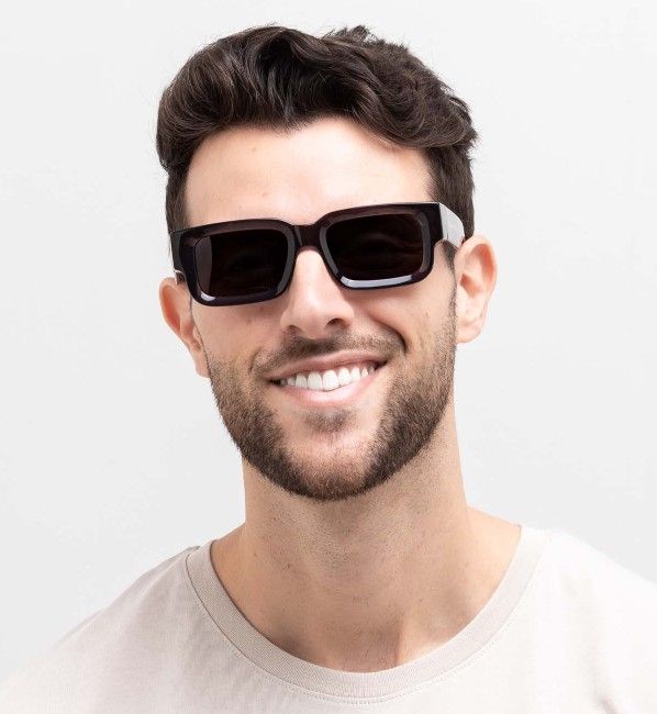man wearing Nova sunglasses, rectangular frames for inverted triangle face shape, on a white background