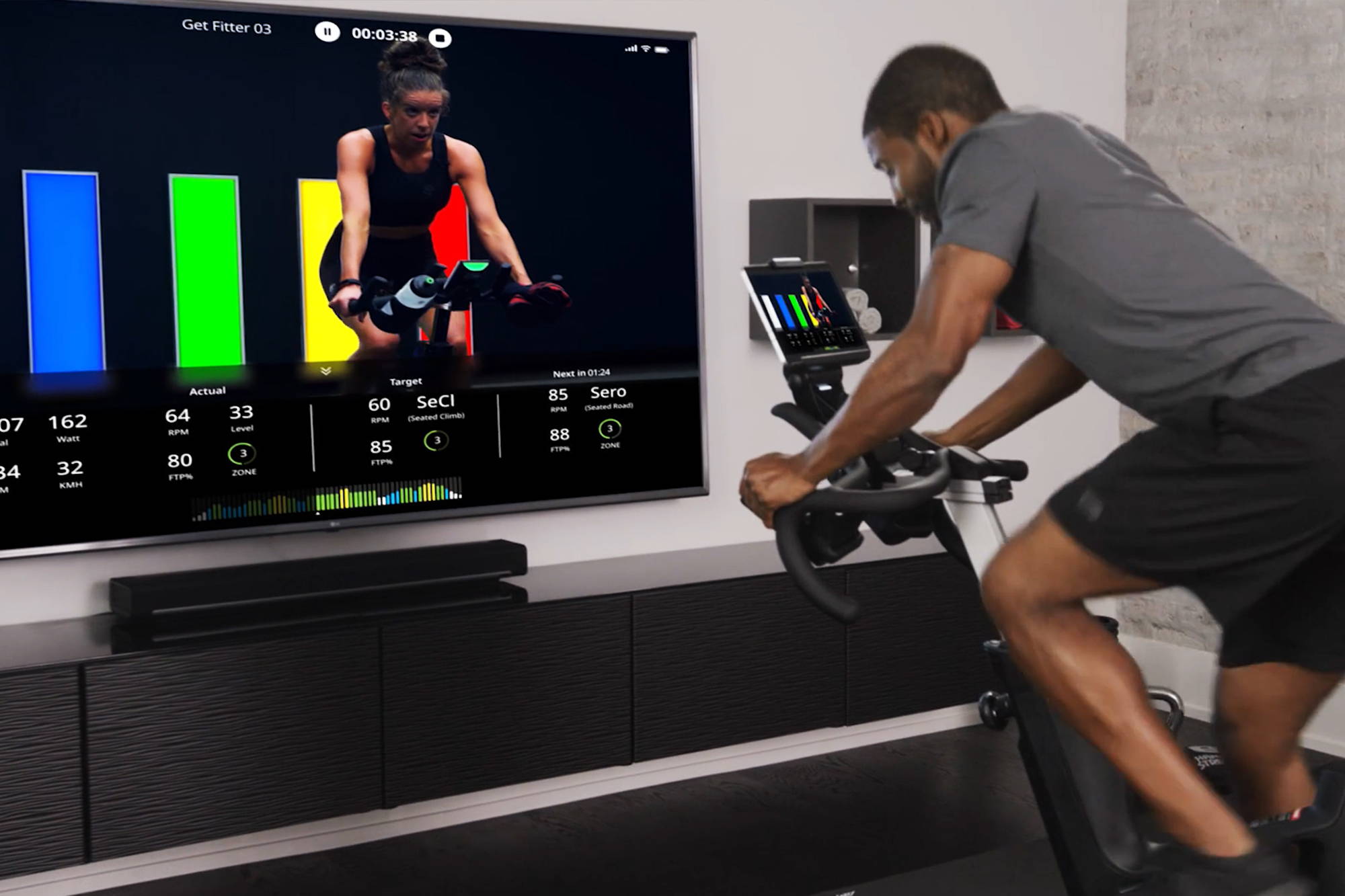 Man exercising on Ride CX while screencasting workout to TV