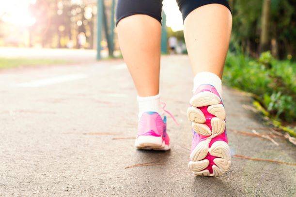 Women Wearing Pink Sports Shoes Walking