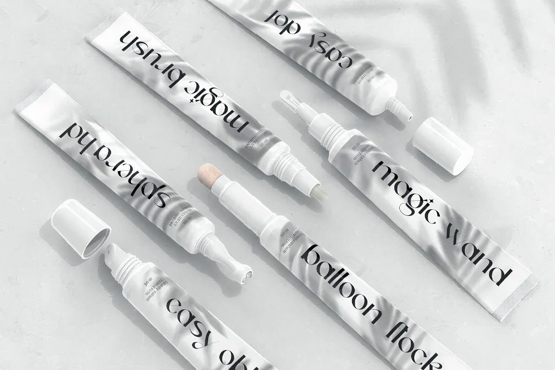 Various skincare tubes with white and gray packaging arranged aesthetically.