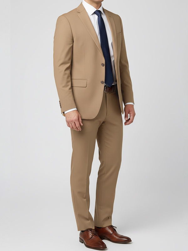 Man wearing a tan suit and navy tie