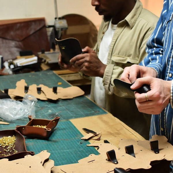 Bonded leather Oscar Deen sunglasses cases in production.