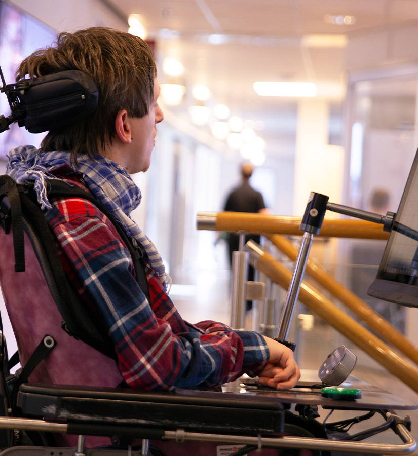 Tobii Dynavox employee working at the office using his assistive communication device.