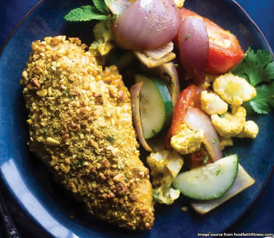 crusted chicken on plate with veggies
