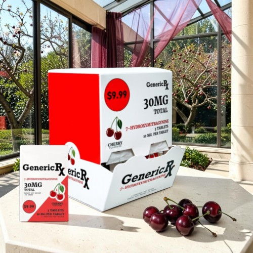 Box of medication with cherries in a bright, sunny setting.