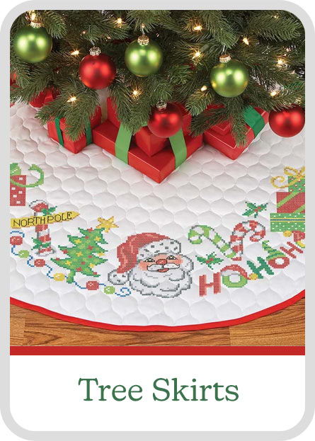 Christmas tree skirt featuring Santa, gifts, and festive decorations. Labeled 
