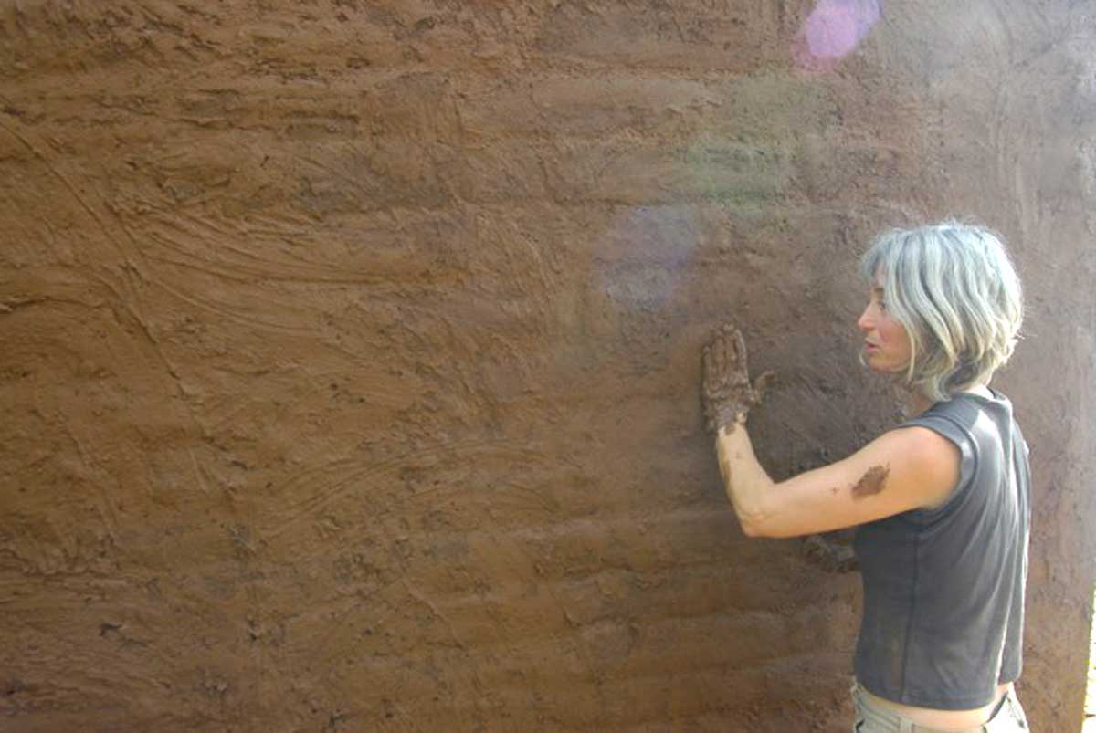 the author plastering a wall