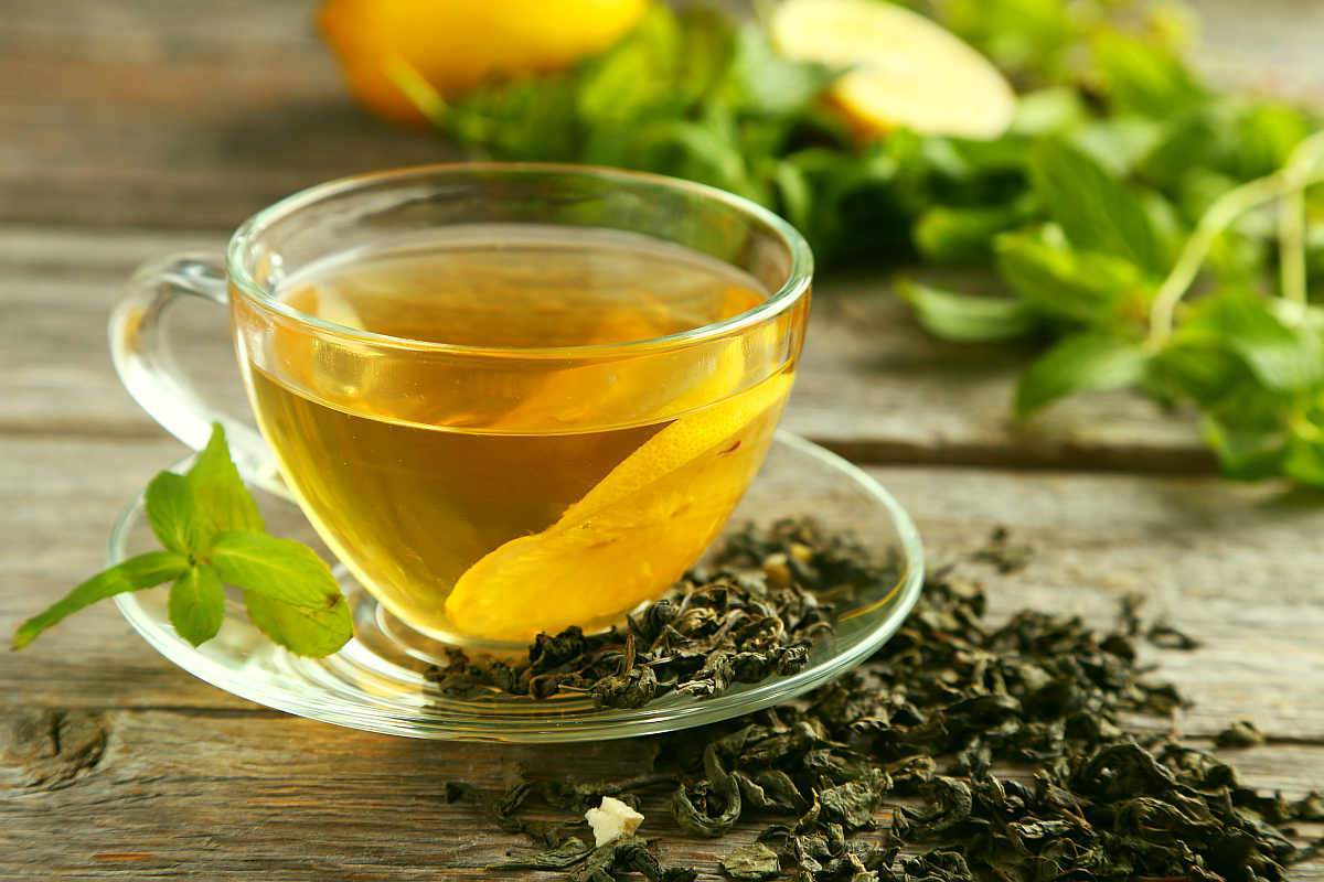 Cup with green tea on grey wooden background | How To Increase Neurogenesis | neurodegenerative diseases