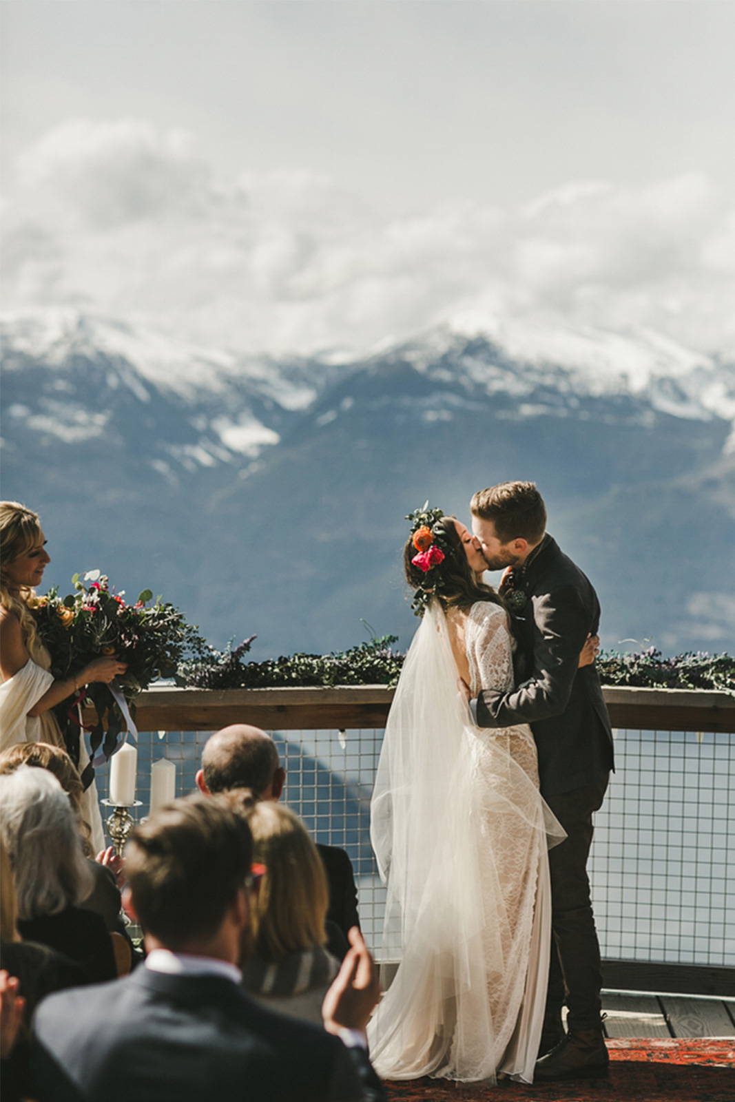 Grace Loves Lace bride kissing with mountain views 